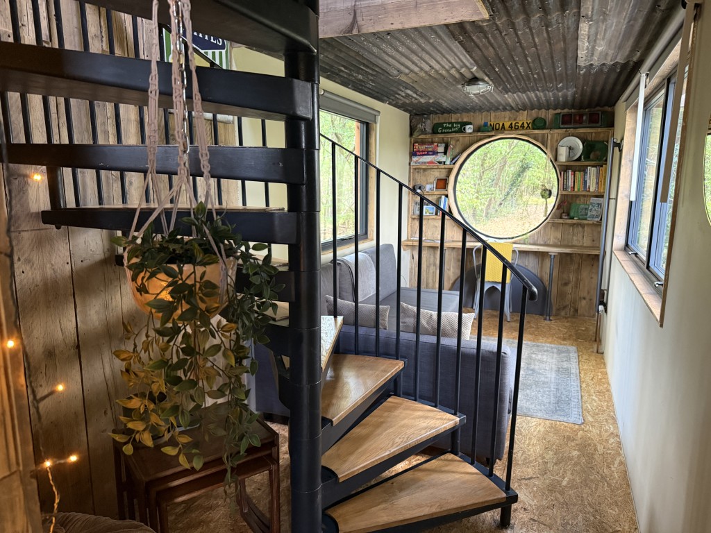 Lot: 188 - APPROX. ONE ACRE OF LAND IN SEMI-RURAL LOCATION WITH UNIQUE HOLIDAY RENTAL - Stairs leading to first floor & lounge area